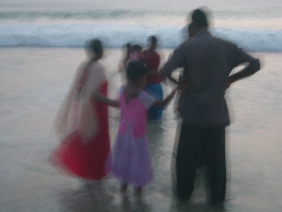 Indian family view sunset at Kovalam beach
